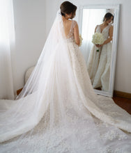 C2023-VS85 - sleeveless v-neck fitted wedding gown with embellished over skirt