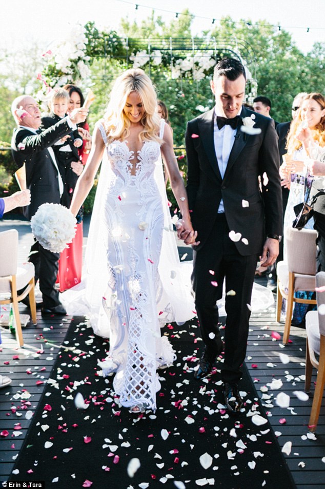 C2020-MArnold – ornate sleeveless fit-to-flare embroidered wedding gown