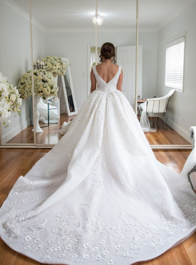 C2022-sbg202 sleeveless beaded ball gown wedding dress with open neckline.