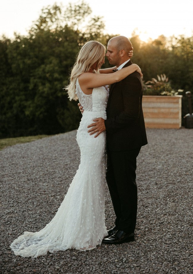 C2023-SV0213 sleeveless v-neck white wedding gown with 3D embellishments