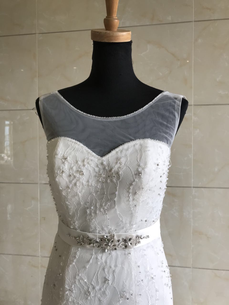 Style DOL-Y003 - Sleeveless illusion neckline wedding gown