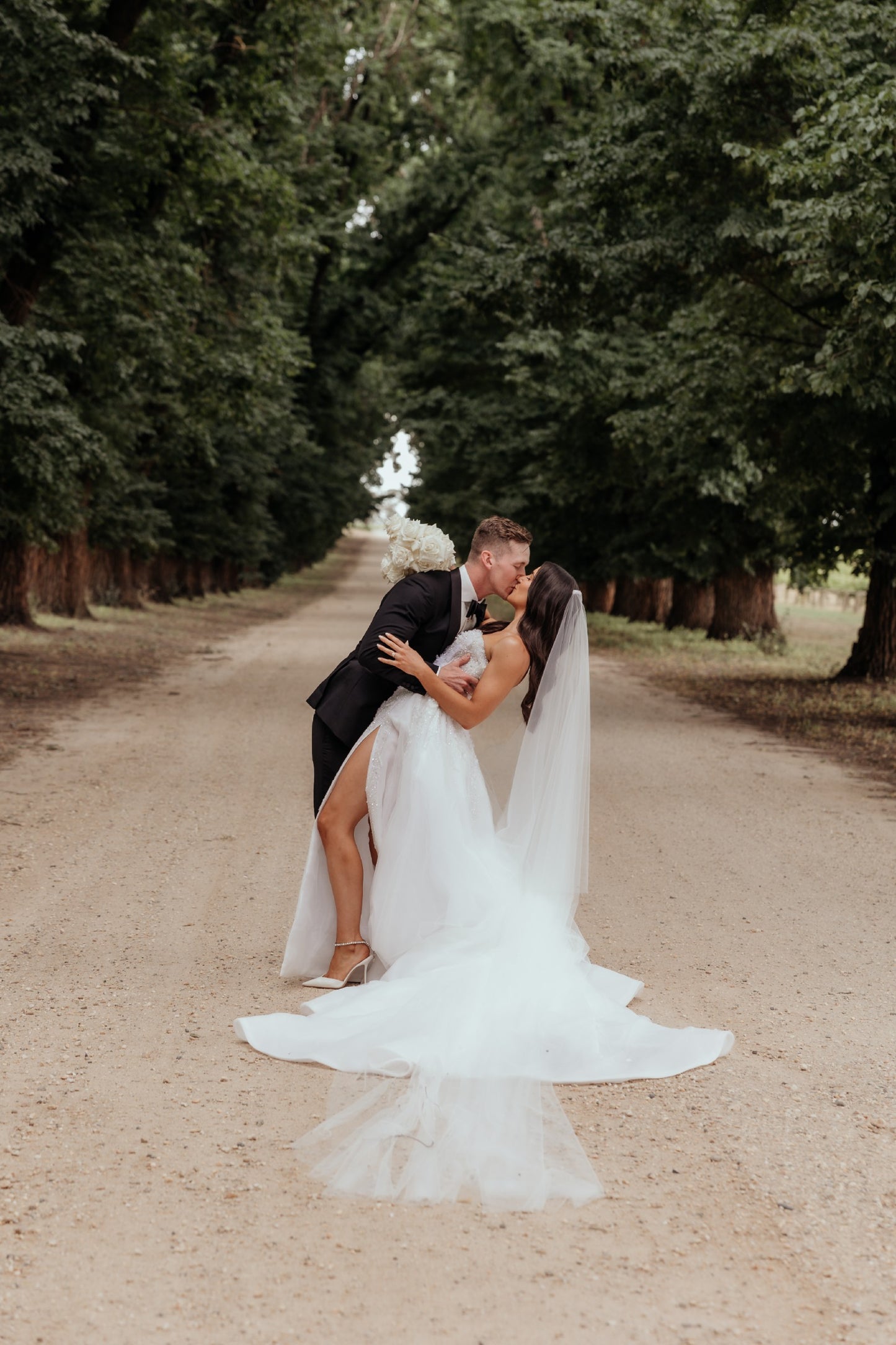 C2023-SS63P - strapless sweetheart beaded wedding gown with thigh high split and detachable train