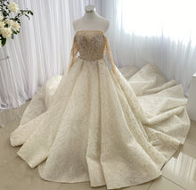C2023-LS31A - Vestido de novia evasé de manga larga transparente con pedrería