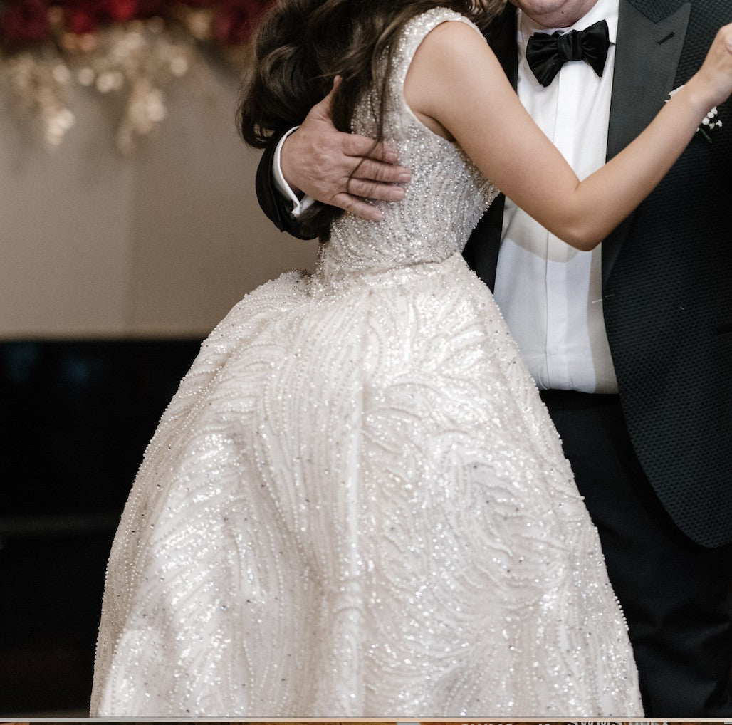 C2023-SD861 - sleeveless open neck line wedding gown with a beaded detachable train