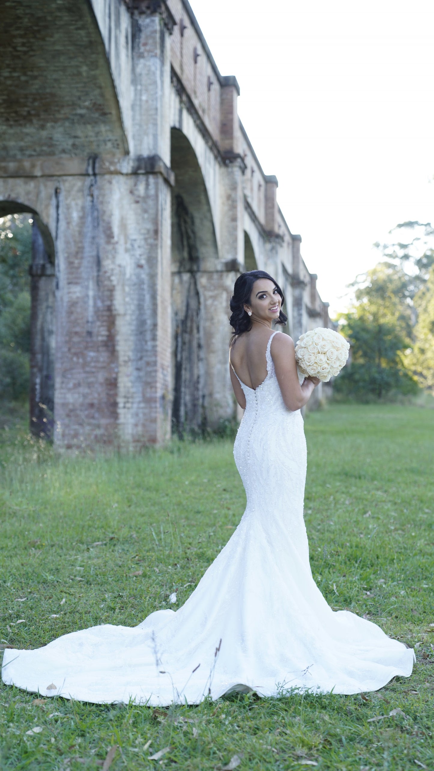 C2024-NAL629 - Sleeveless beaded fit-to-flare wedding gown with chapel train