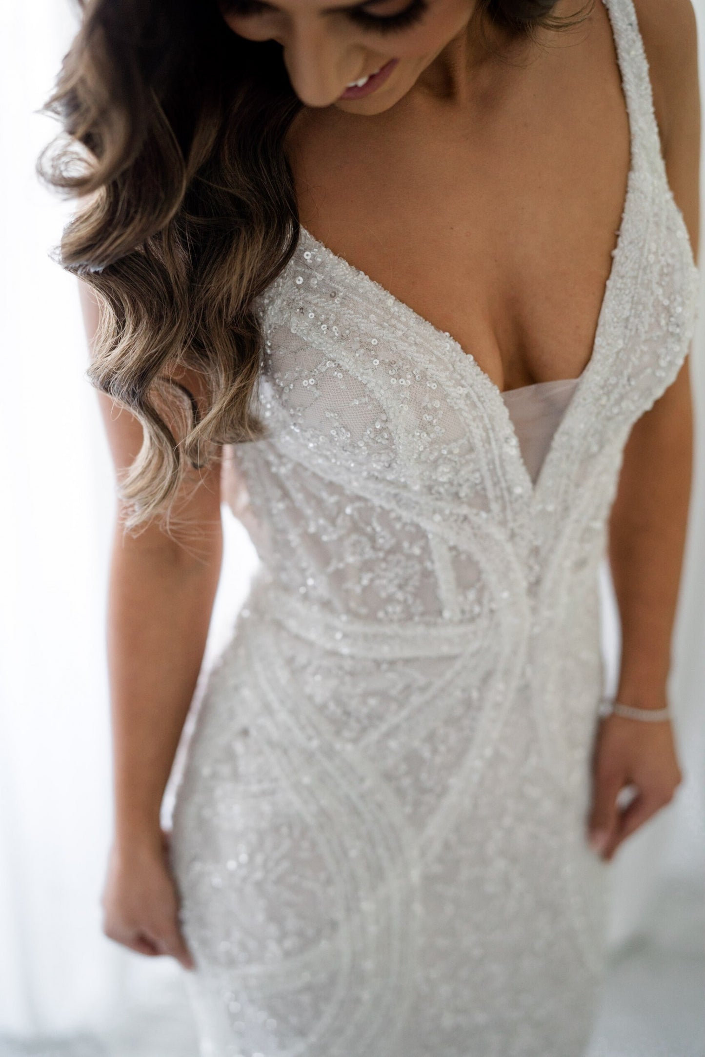 C2023-B638 - sleeveless beaded v-neck wedding gown with detachable over skirt