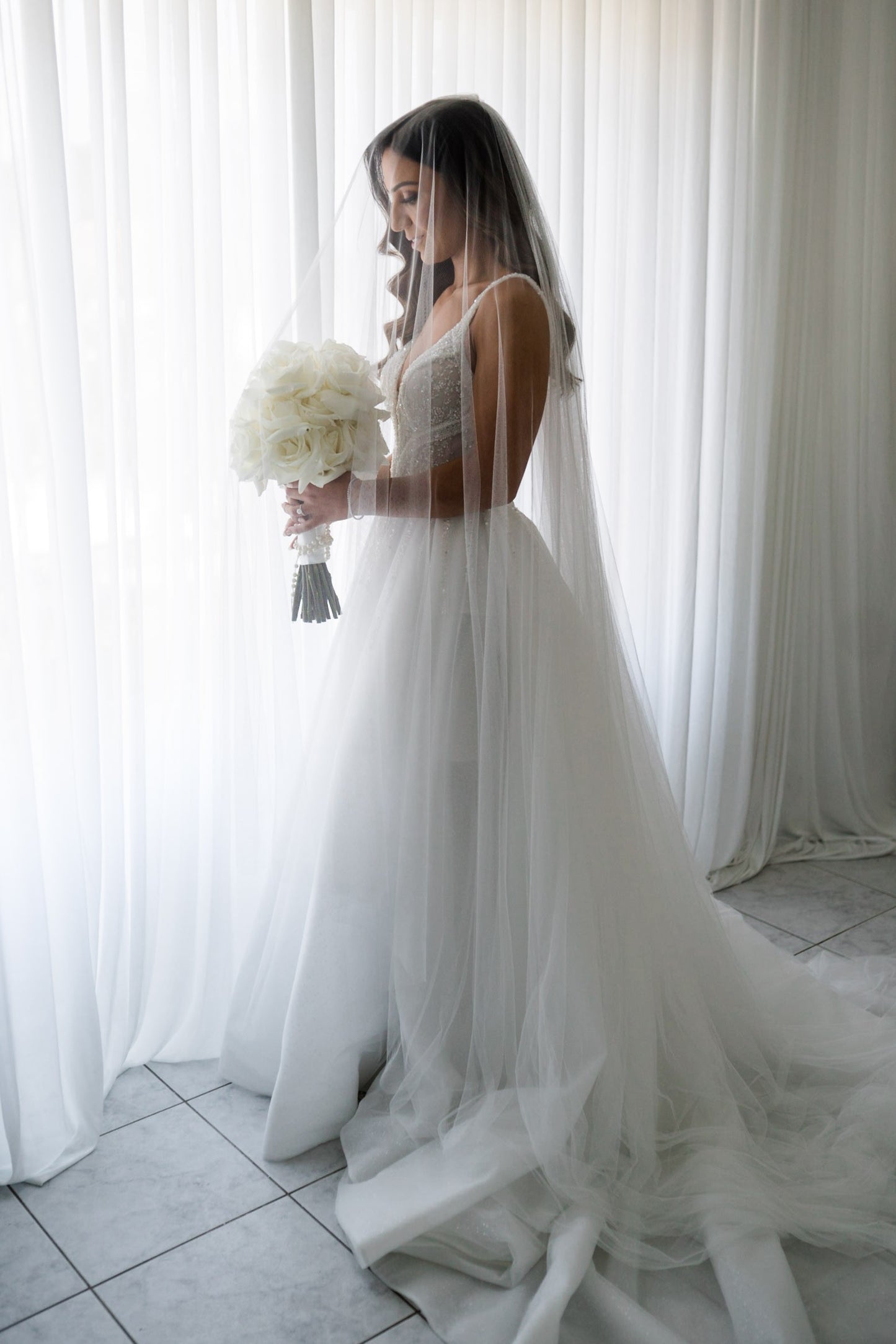 C2023-B638 - sleeveless beaded v-neck wedding gown with detachable over skirt