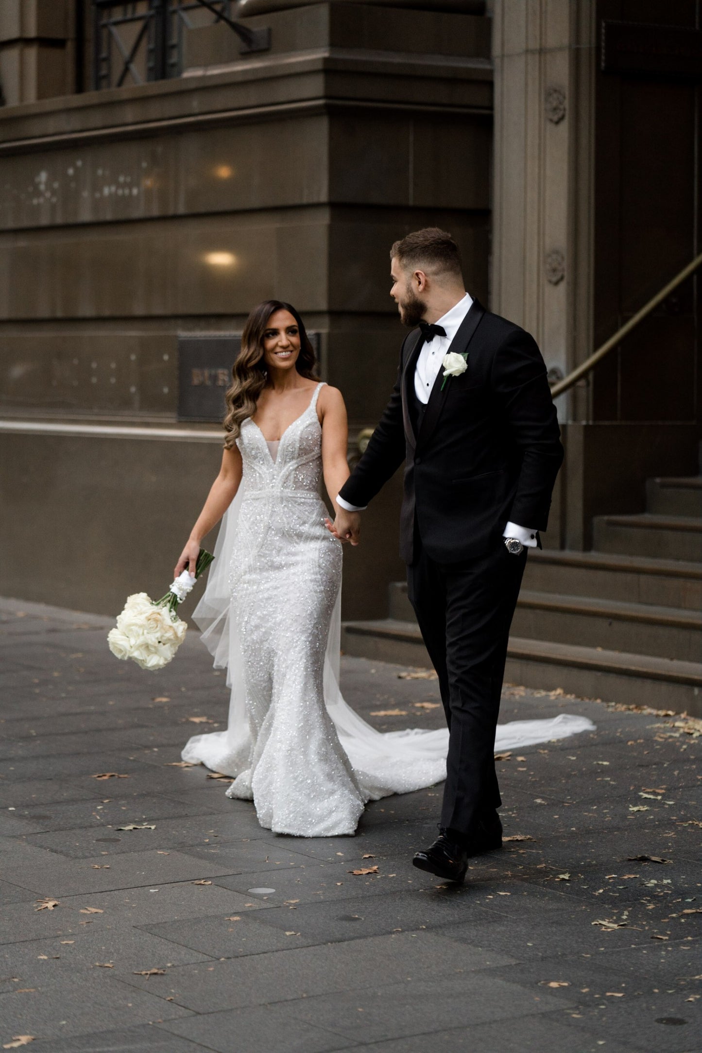 C2023-B638 - sleeveless beaded v-neck wedding gown with detachable over skirt