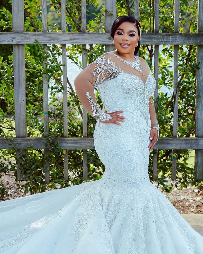 C2026-LA0527 - illusion neckline sheer long sleeve crystal beaded fit-to-flare wedding gown