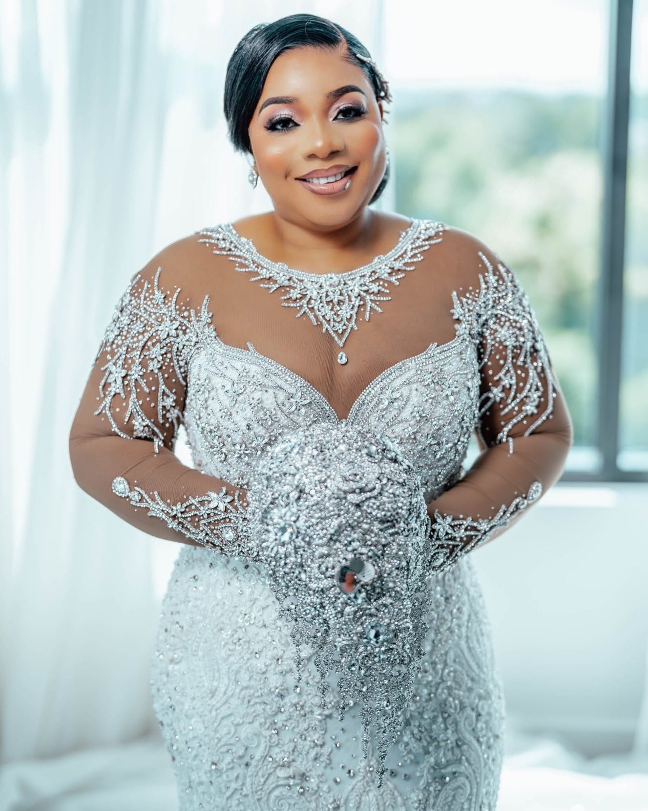 C2026-LA0527 - illusion neckline sheer long sleeve crystal beaded fit-to-flare wedding gown