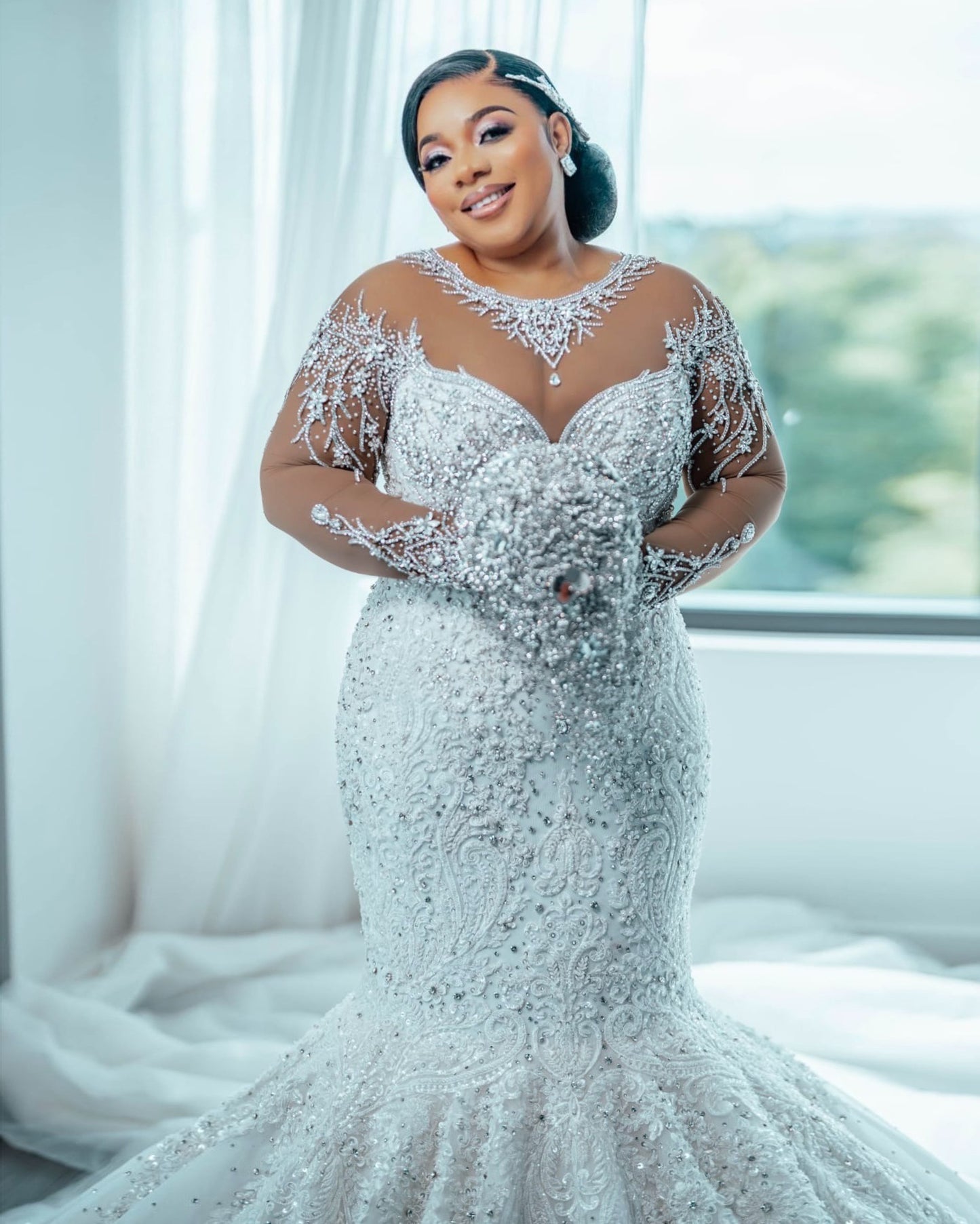 C2026-LA0527 - illusion neckline sheer long sleeve crystal beaded fit-to-flare wedding gown