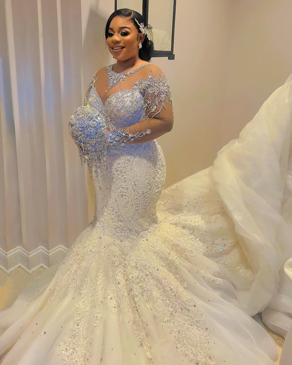 C2026-LA0527 - illusion neckline sheer long sleeve crystal beaded fit-to-flare wedding gown