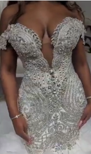 C2022-FF787 - Vestido de novia de vuelo, con hombros descubiertos, pedrería de cristal de Swarovski y falda sirena de tul con volantes