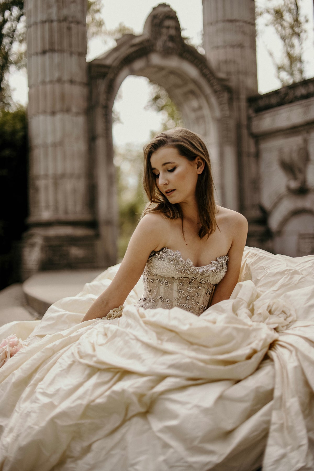 Bride in a flowing wedding dress with a crystal-embellished bodice
