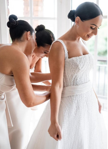 C2024-BA503 - Beaded White fitted wedding gown with detachable train and shoulder straps