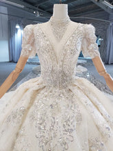Style 820-16 Short sleeve v-neck beaded wedding gown from DARIUS BRIDAL