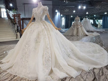 Style 820-16 Short sleeve v-neck beaded wedding gown from DARIUS BRIDAL