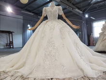 Style 820-16 Short sleeve v-neck beaded wedding gown from DARIUS BRIDAL