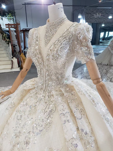 Style 820-16 Short sleeve v-neck beaded wedding gown from DARIUS BRIDAL
