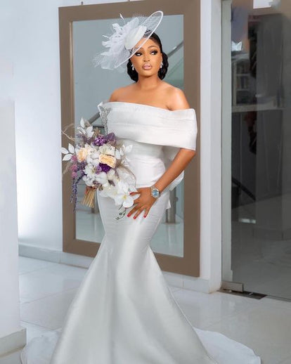 simple white off the shoulder wedding dress Djaminas  A & M Enterprises Bridal