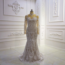 Style #T422 - sheer illusion neckline long sleeve wedding gown with detachable train