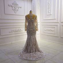 Style #T422 - sheer illusion neckline long sleeve wedding gown with detachable train