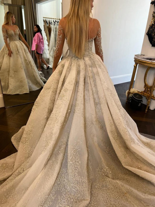C2022-SLS009 - Sheer illusion neckline long sleeve beaded wedding ball gown