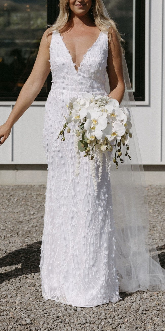 C2023-SV0213 sleeveless v-neck white wedding gown with 3D embellishments