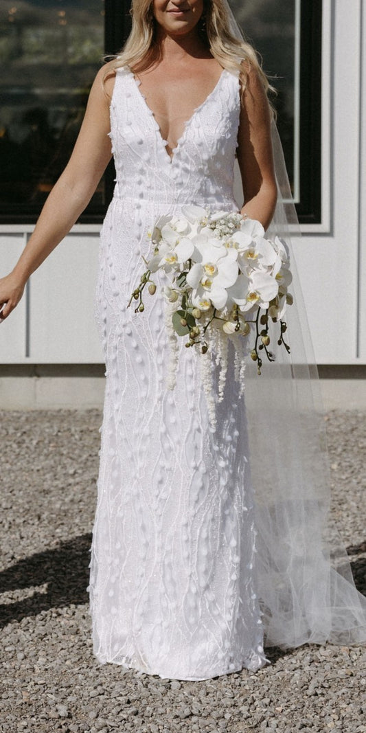 C2023-SV0213 sleeveless v-neck white wedding gown with 3D embellishments