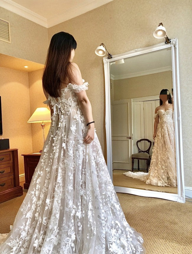 Off the shoulder a-line bridal gown with flower detail