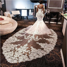 C2021-BiM012 - sheer long sleeve illusion neck line crystal beaded wedding gown with cathedral train