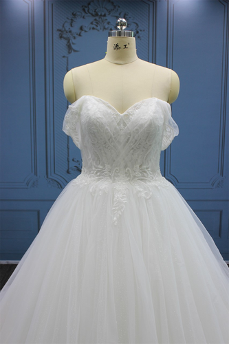Style #WT4407 Strapless ball gown wedding dress with sheer are cuffs