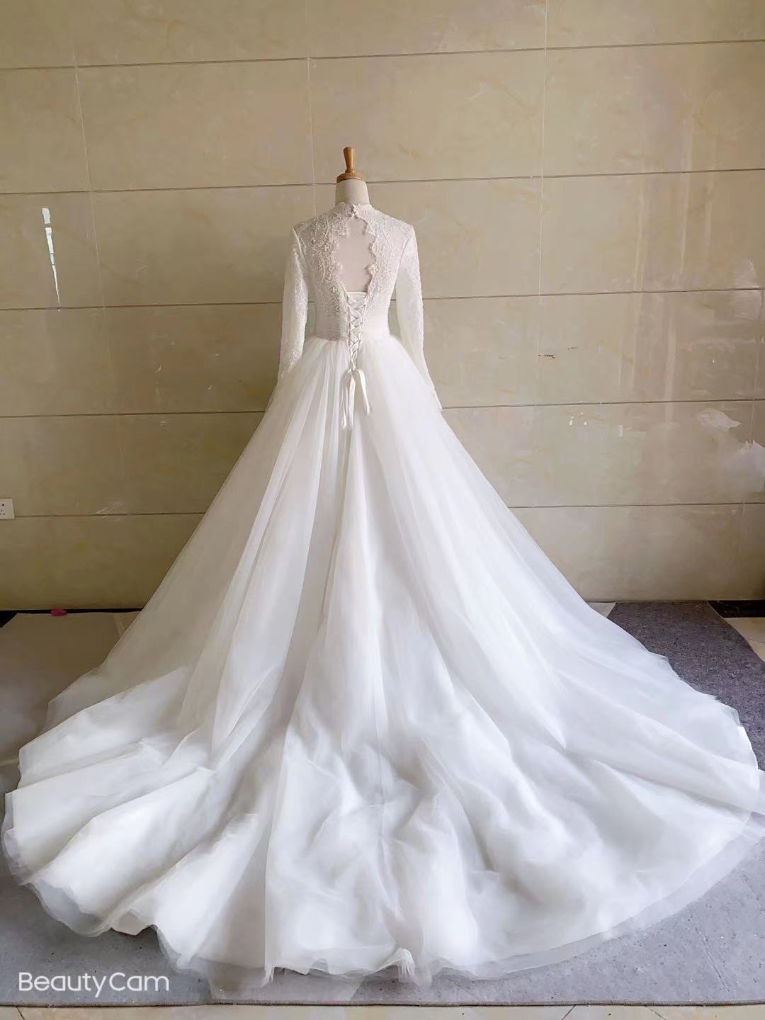 Sheer long sleeve a-line wedding gown